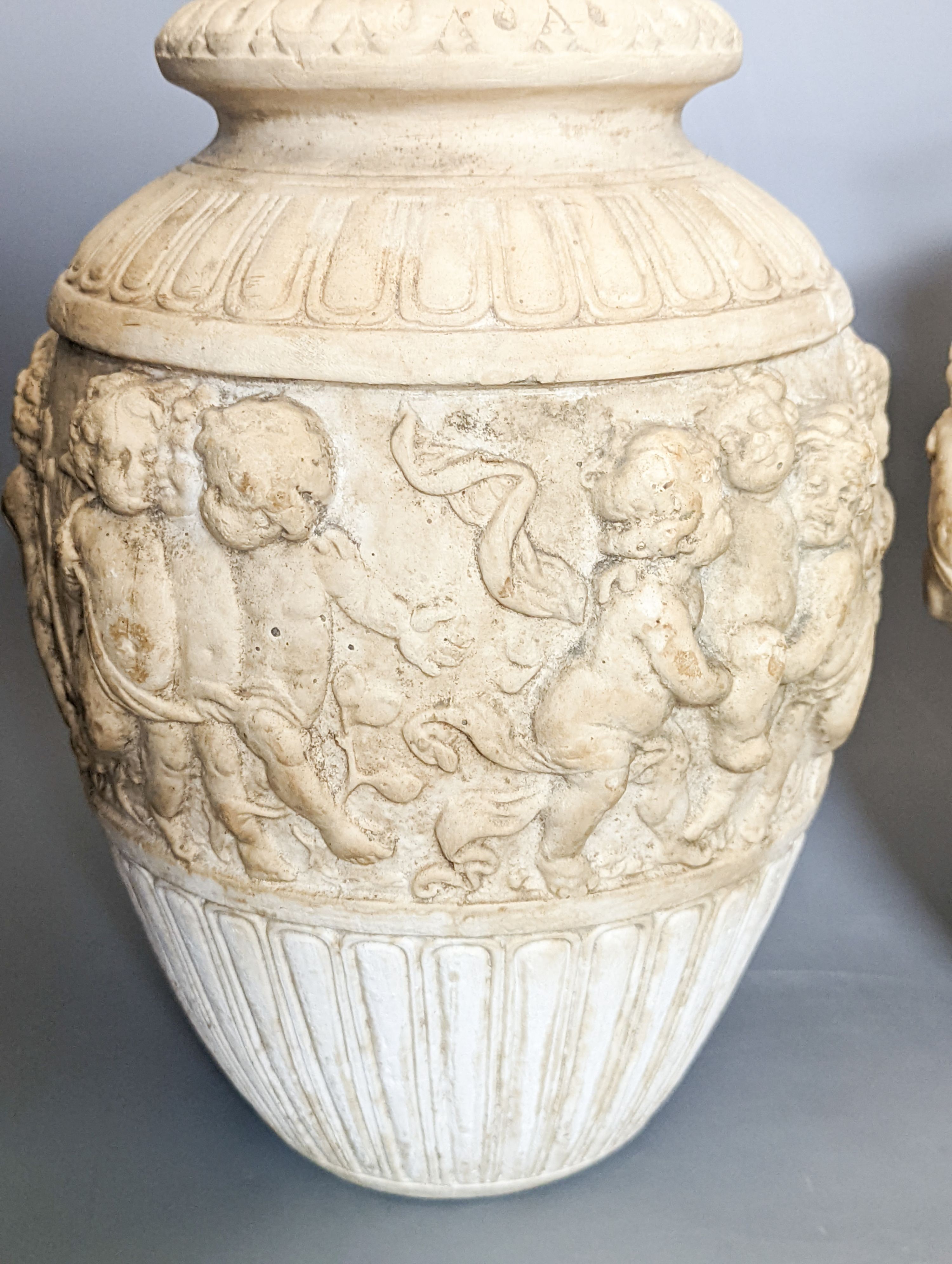 A pair of 19th century earthenware vases moulded in Italian renaissance style 30cm